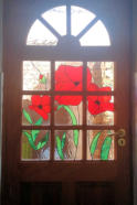 red flowers stained glass on door