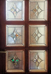 a door with 6 stained glass panels
