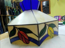 stained glass lamp shade with red and yellow flowers